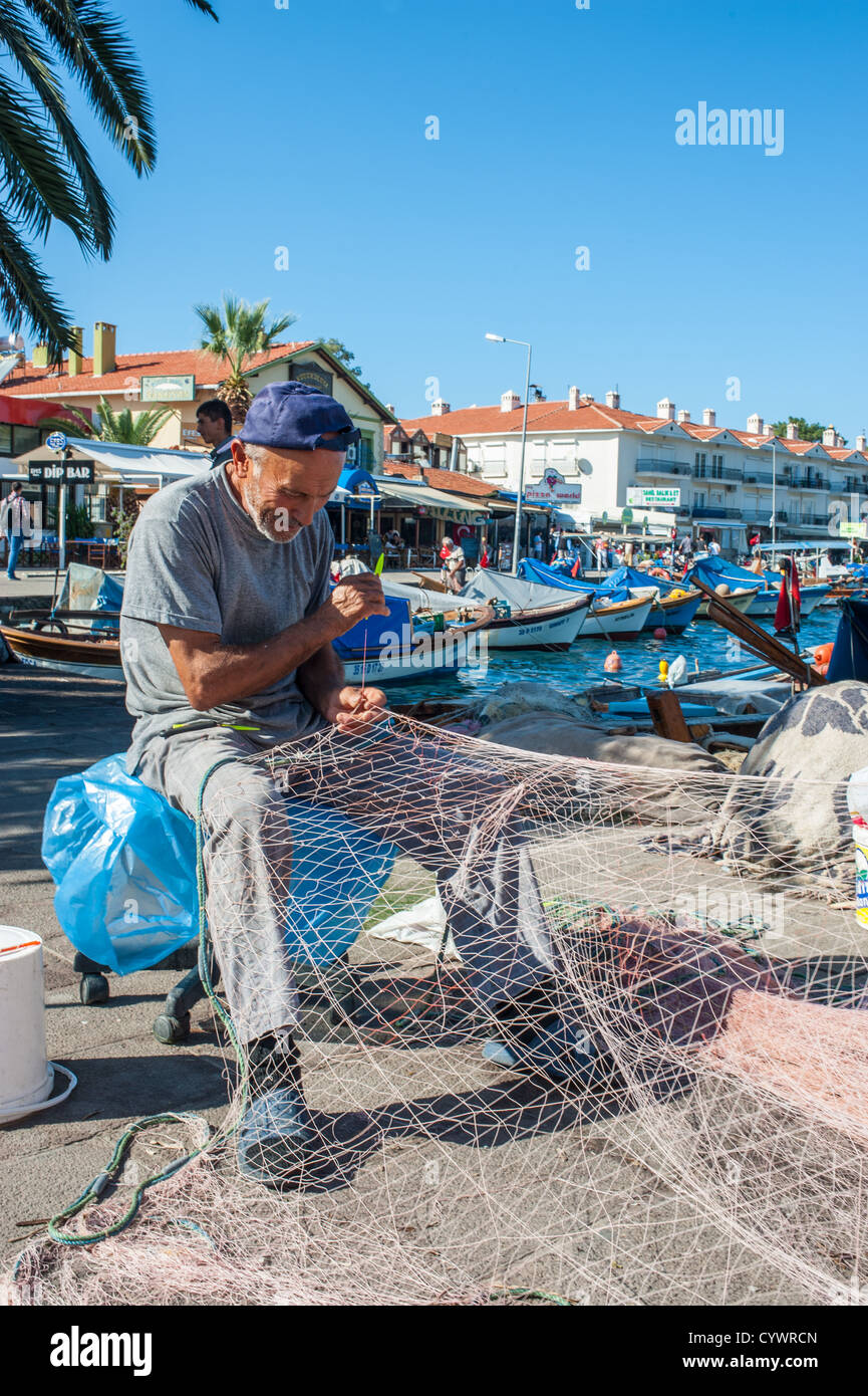 Mending fishing nets harbour edge hires stock photography and images