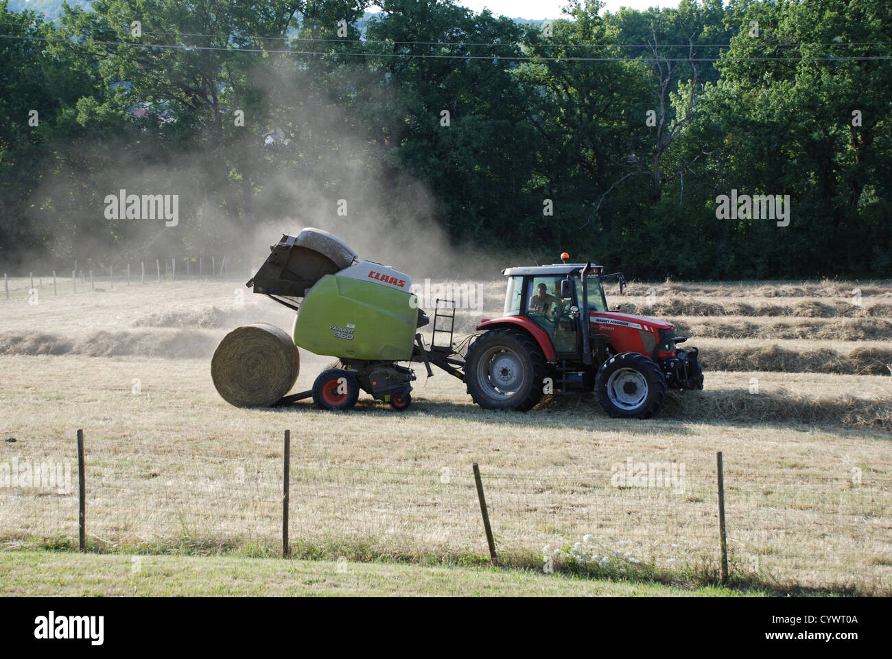 French Tractor baling hay Stock Photo Alamy