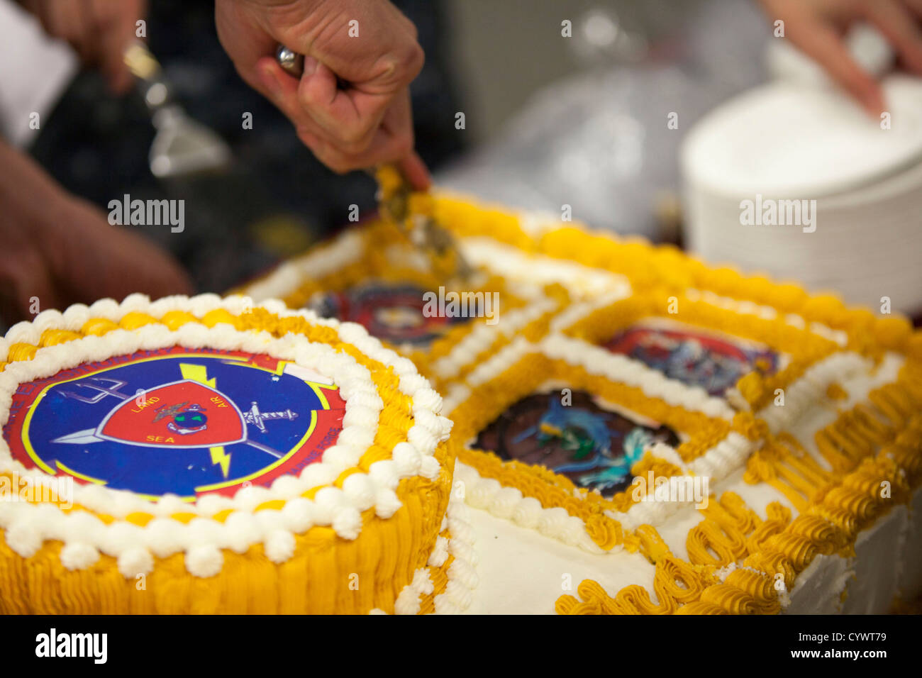 A birthday cake is cut and shared with the Marine and sailors assigned to the 26th Marine Expeditionary Unit (MEU) at a U.S. Mar Stock Photo