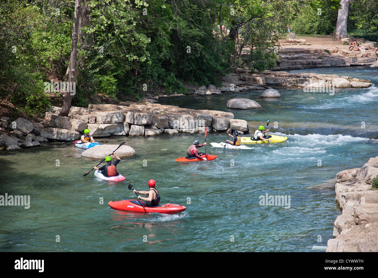 Kayakers maneuvering, San Marcos River, Texas. Stock Photo