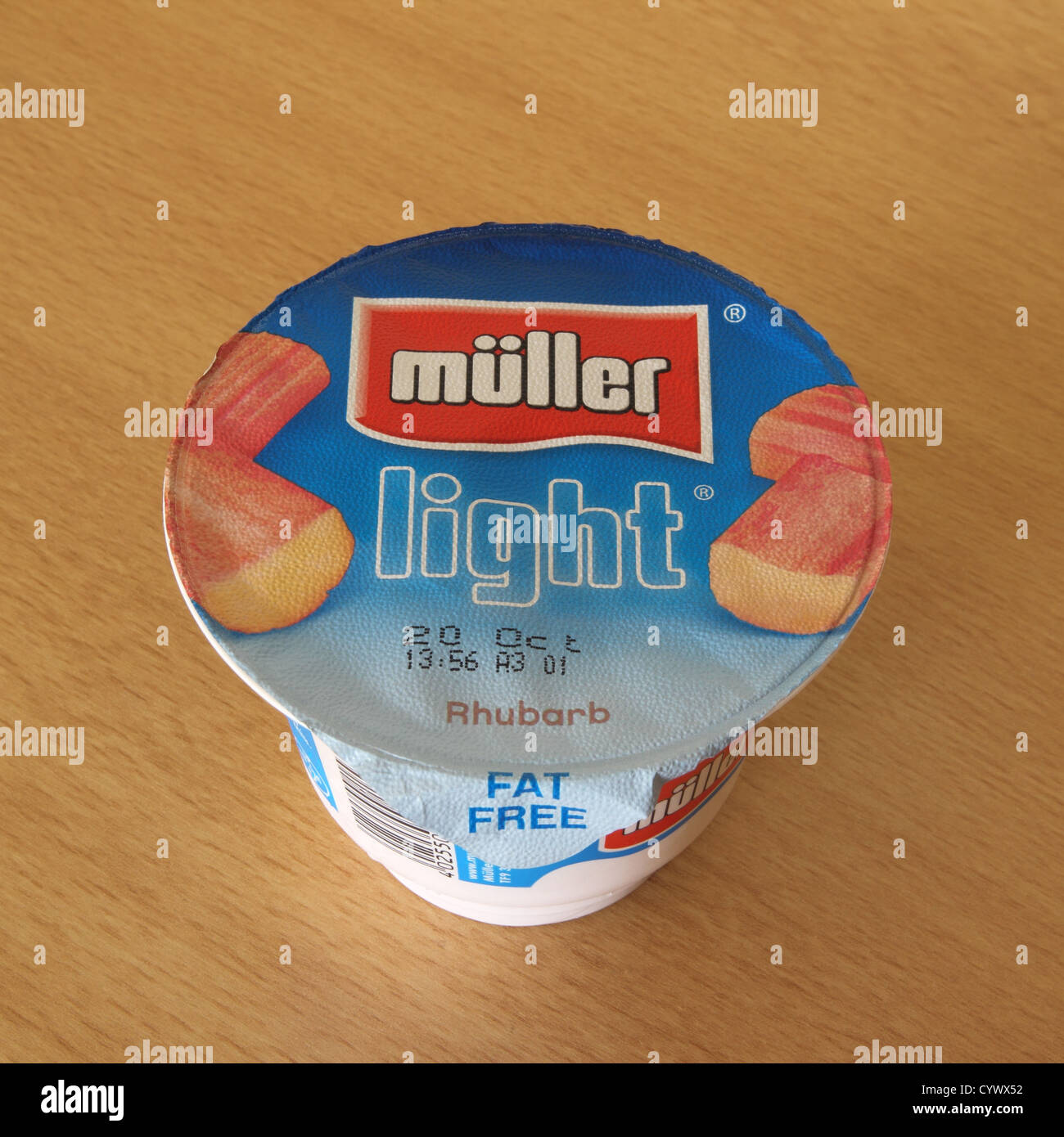 Pot of Muller Light Rhubarb Yoghurt Stock Photo