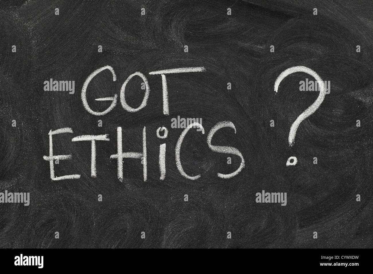 Got ethics? Are you ethical question handwritten with white chalk on blackboard with eraser smudges Stock Photo