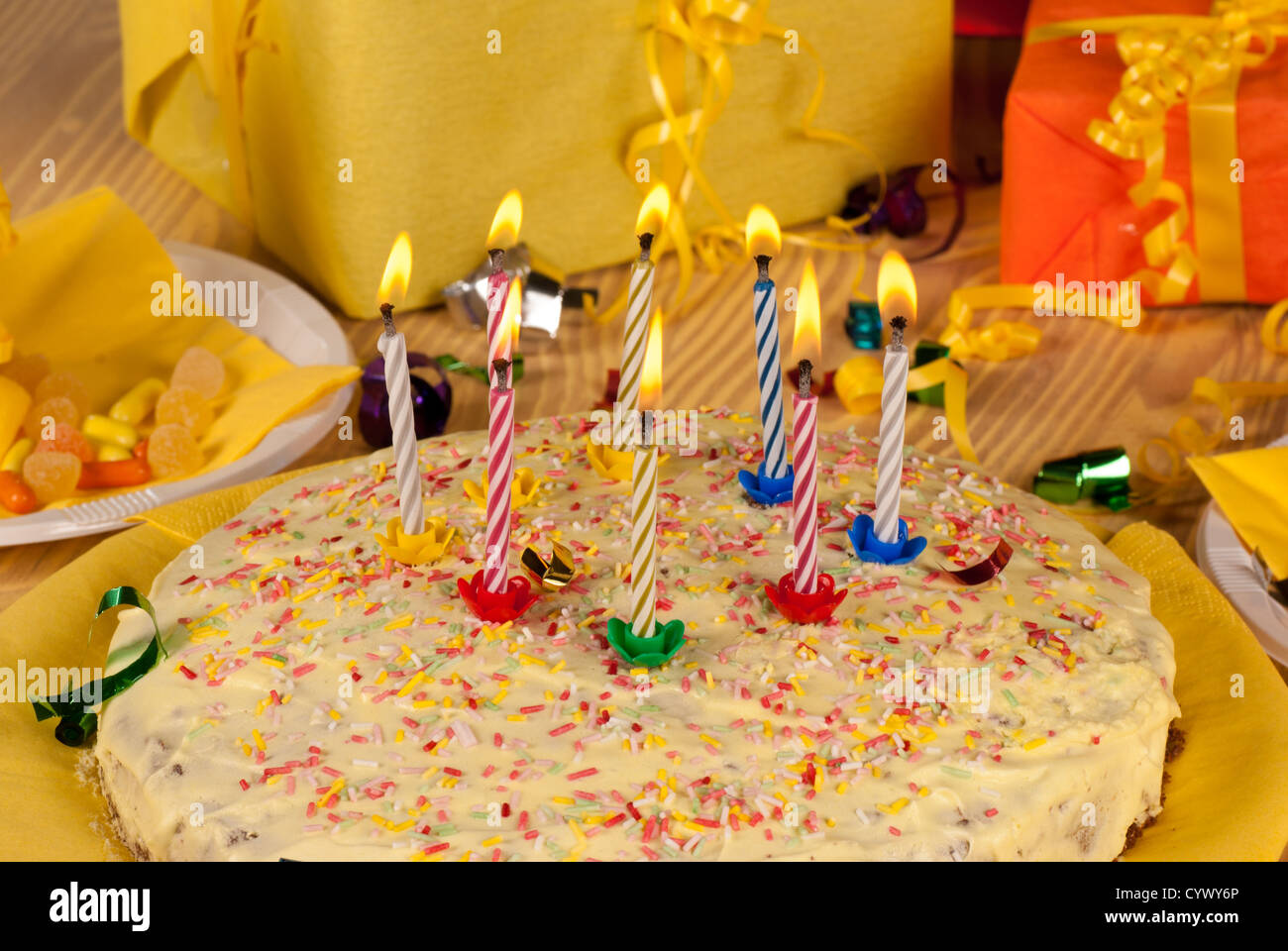 Birthday cake with its candles being blown Stock Photo Alamy