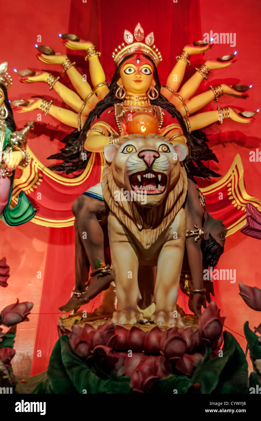 Durga Idol on lion, traditional, worship, Hindu, Hinduism, Bengal culture, extravagant, earthen, colorful, travel Stock Photo