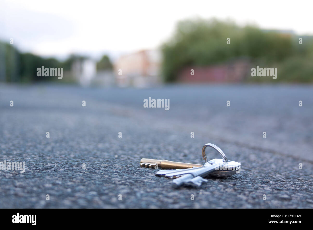 Keys on a pavement near some buildings Stock Photo