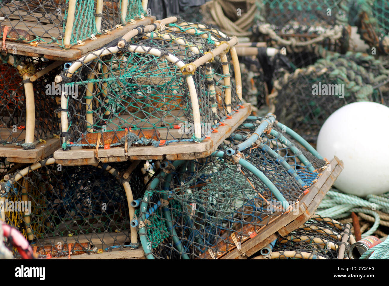Lobster pots and creels in pile seen in harbor. Stock Photo