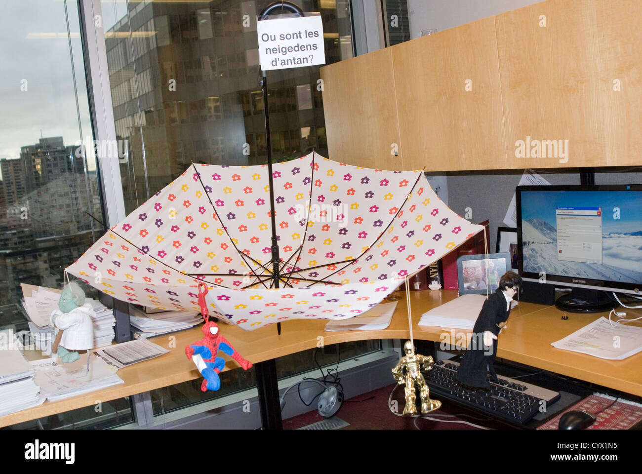 An Office Prank Upside Umbrella On A Desk Toys Spread Out On