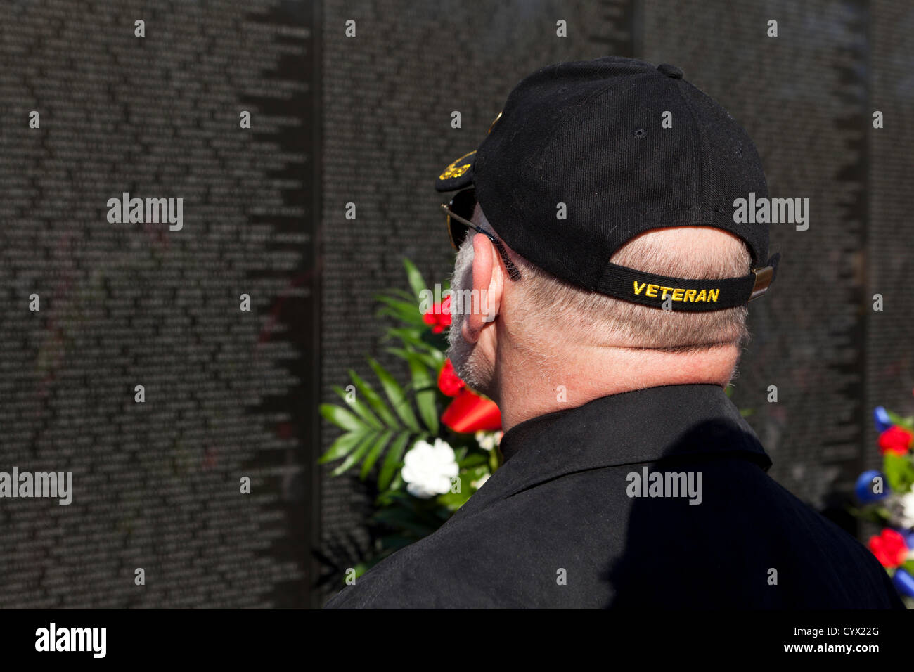 November 11, 2012: A veteran searches for a fallen soldier's name on the Vietnam War Memorial - Washington, DC USA Stock Photo