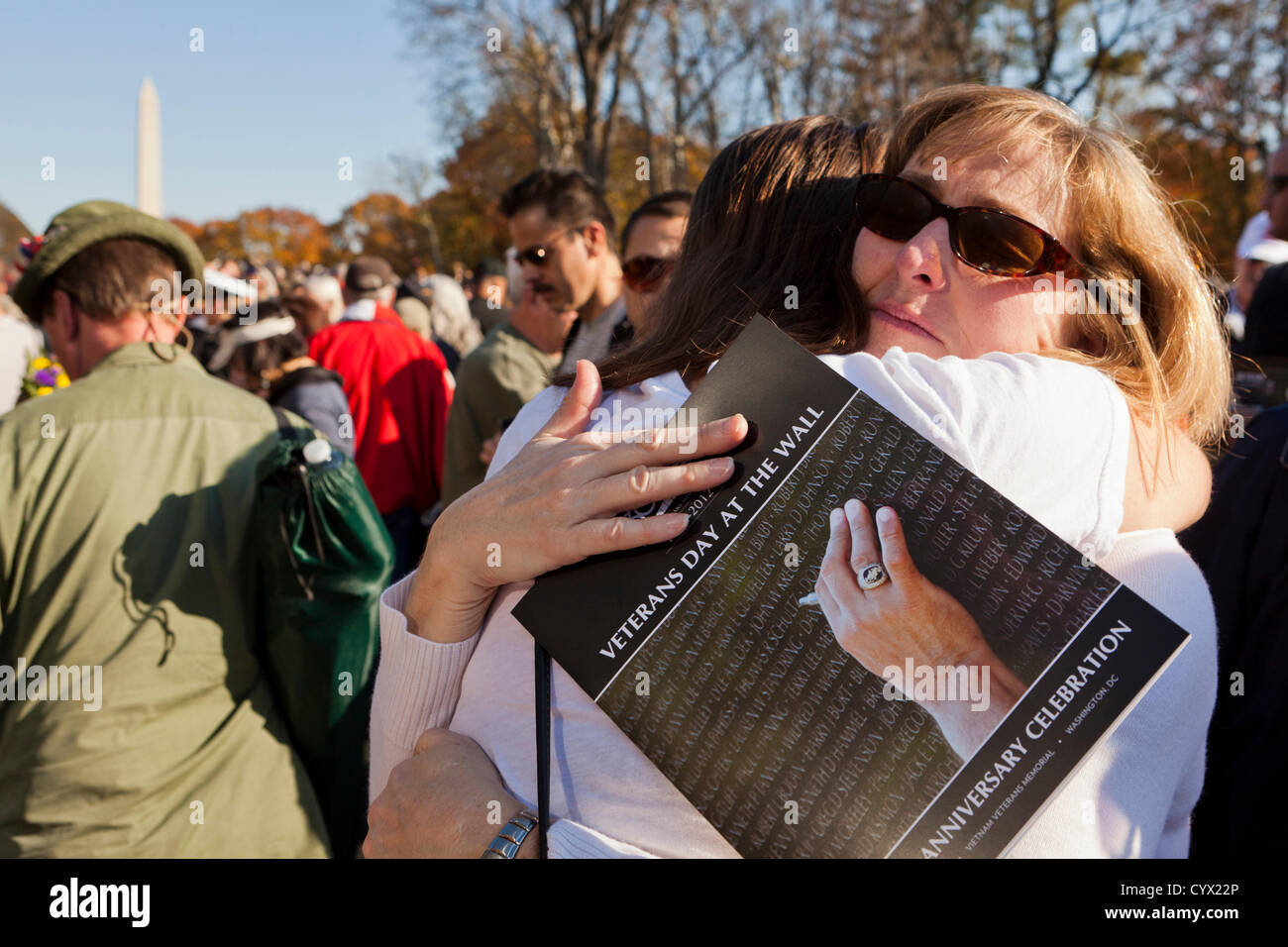 November 11, 2012: A woman consoles a family member of a fallen Vietnam veteran, in front of the Vietnam War Memorial during the Veterans Day celebrations - Washington, DC USA Stock Photo