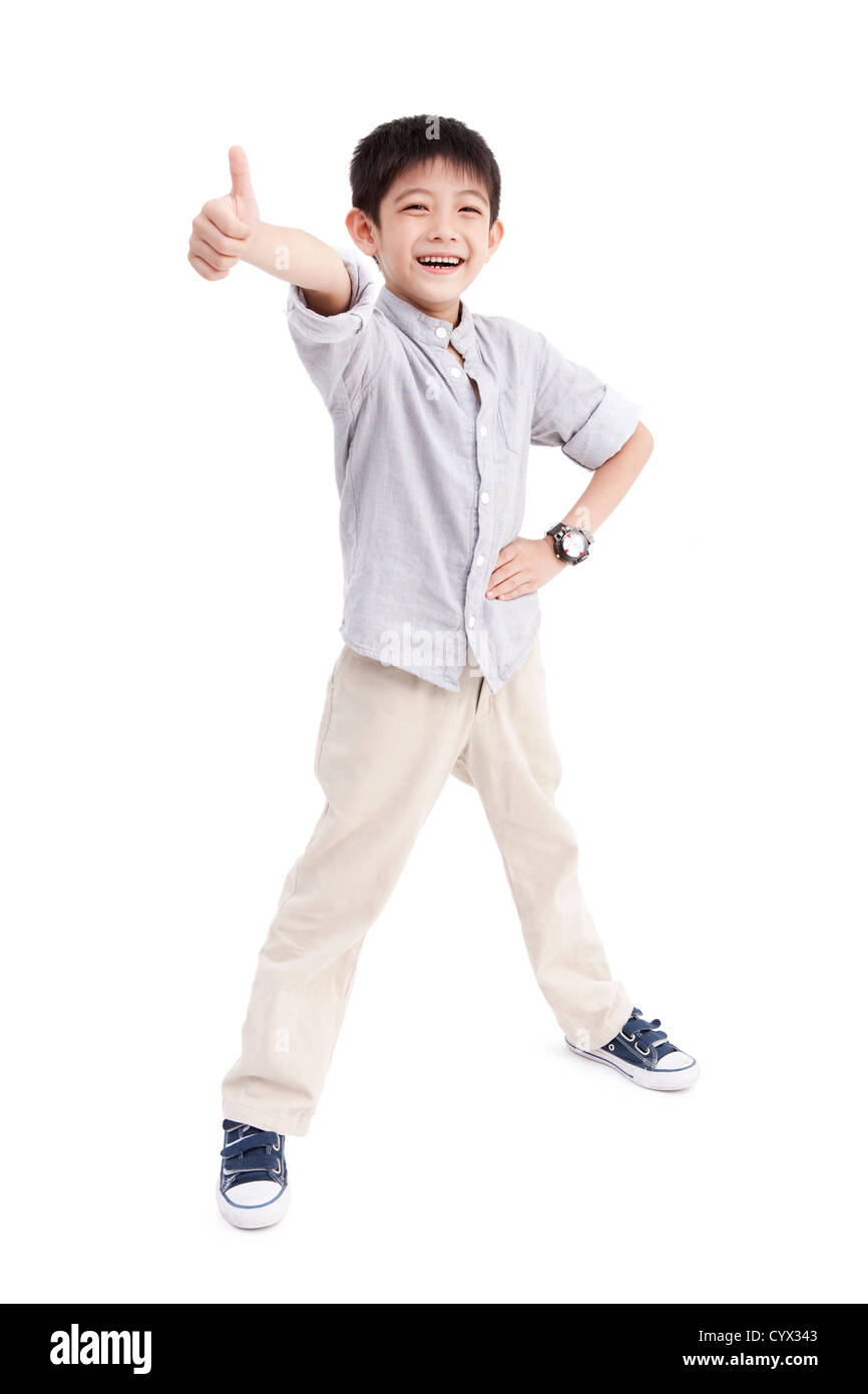 Portrait of cute boy doing thumbs up Stock Photo - Alamy