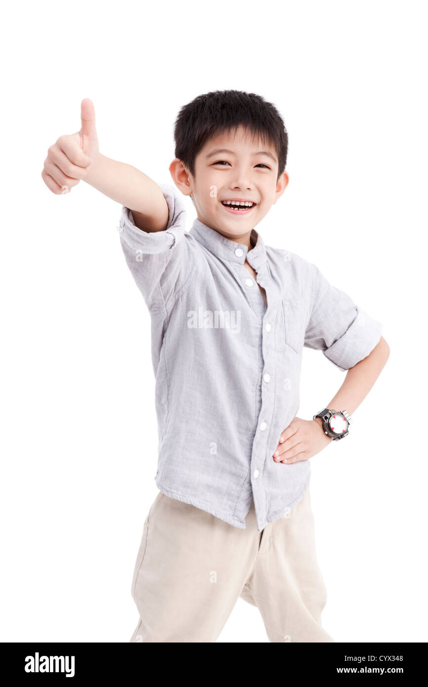 Portrait of cute boy doing thumbs up Stock Photo - Alamy