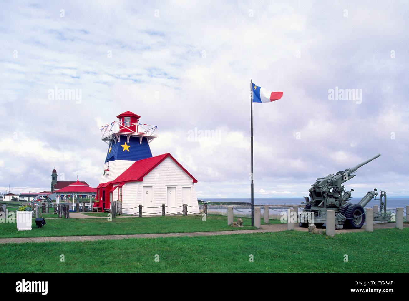 Grande Anse, New Brunswick, Canada - Replica Lighthouse / Tourist Info Centre painted in Acadian Flag Blue, White, and Red Stock Photo