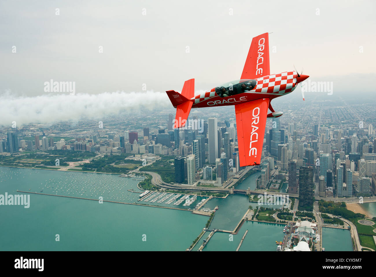 Sean Tucker of Team Oracle flies in front of the Chicago skyline on the Chicago Air & Water Show media preview day. Stock Photo