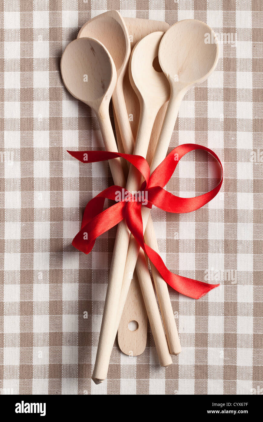 wooden kitchen utensil on checkered napkin Stock Photo