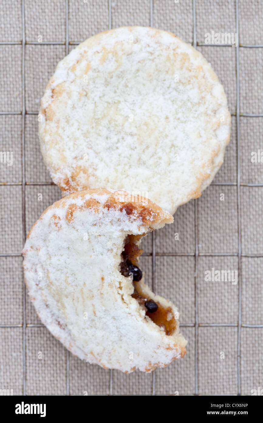 Two short crust pastry mince pies on a cooling tray Stock Photo Alamy
