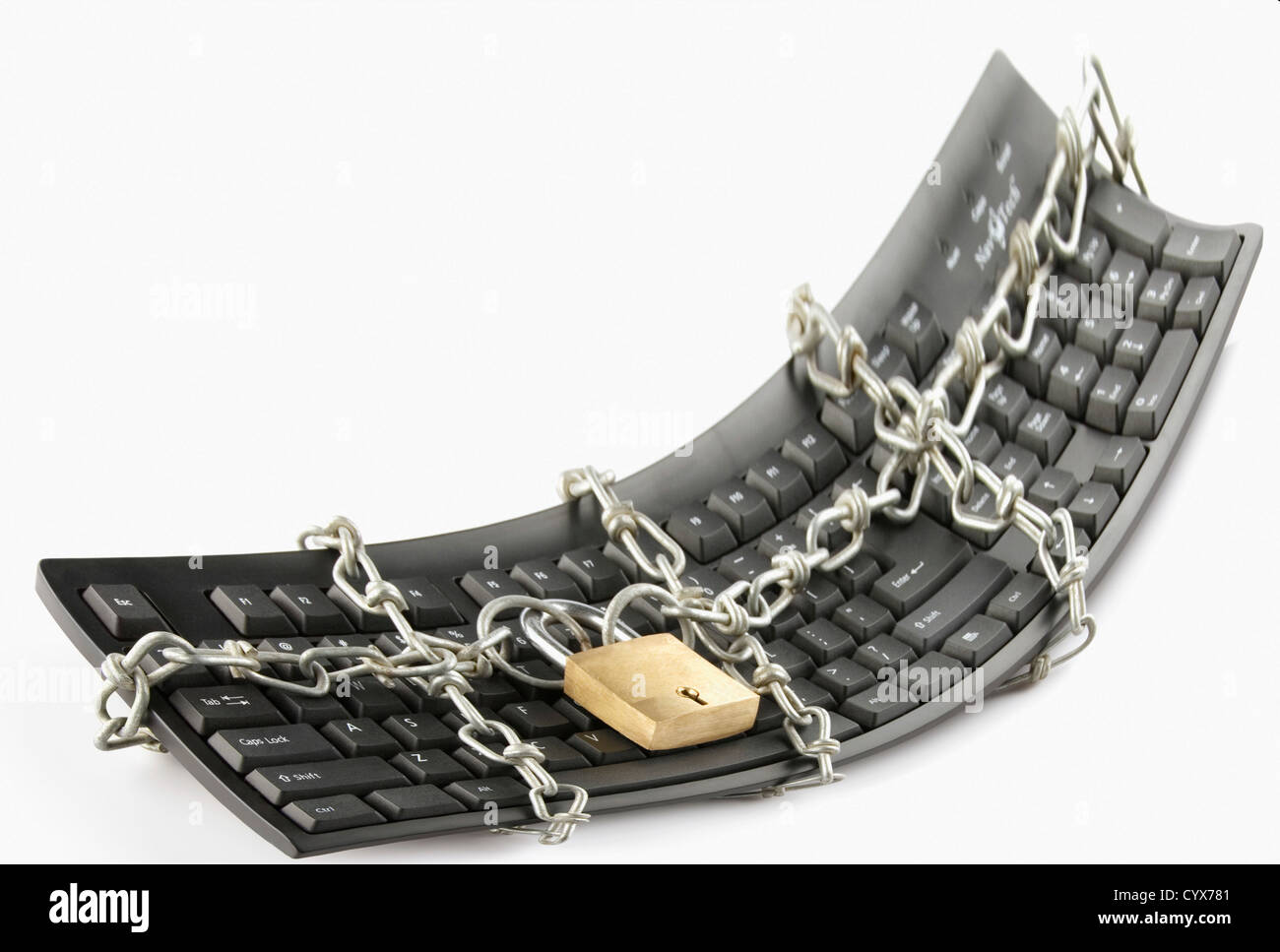 Computer keyboard locked with chain and padlock Stock Photo Alamy