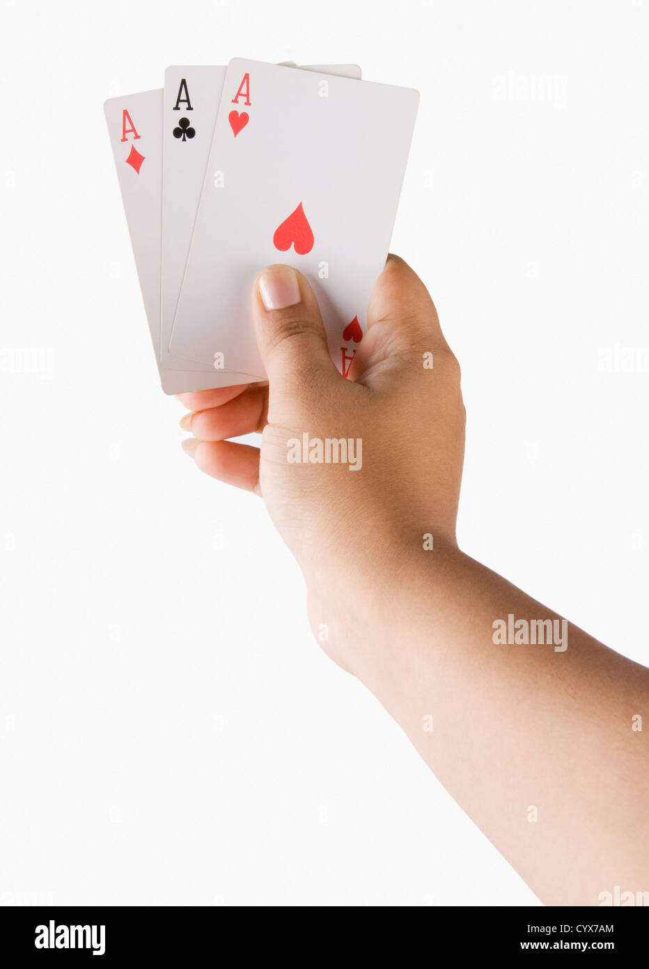 Close-up of a woman's hand holding playing cards Stock Photo