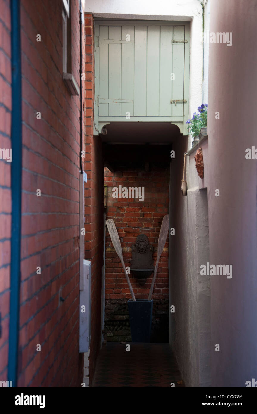 entry passage between terraced houses Stock Photo Alamy