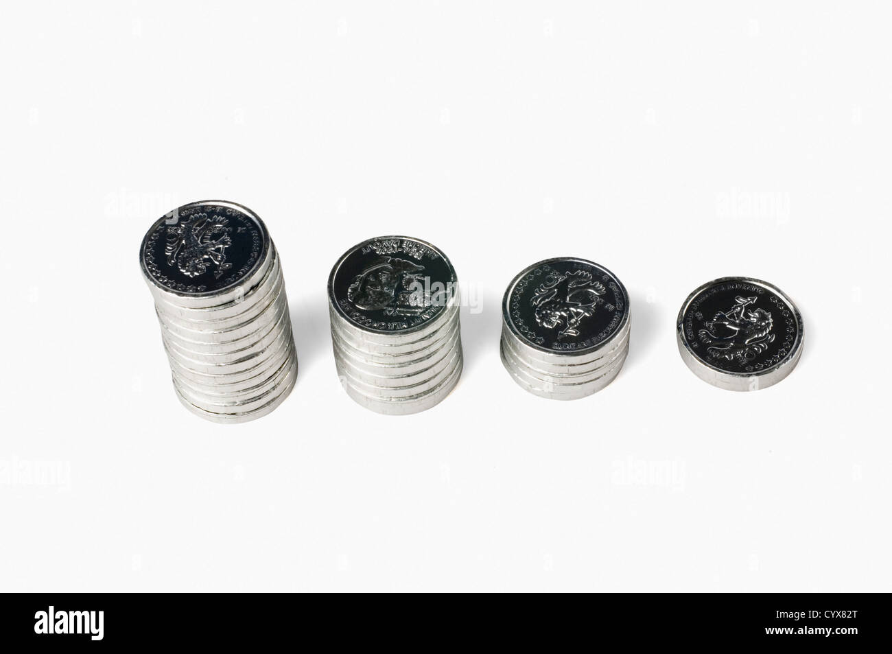 Coin Stack Shrinking Stacks of coins depicting a bar graph of declining economy Stock Photo ...