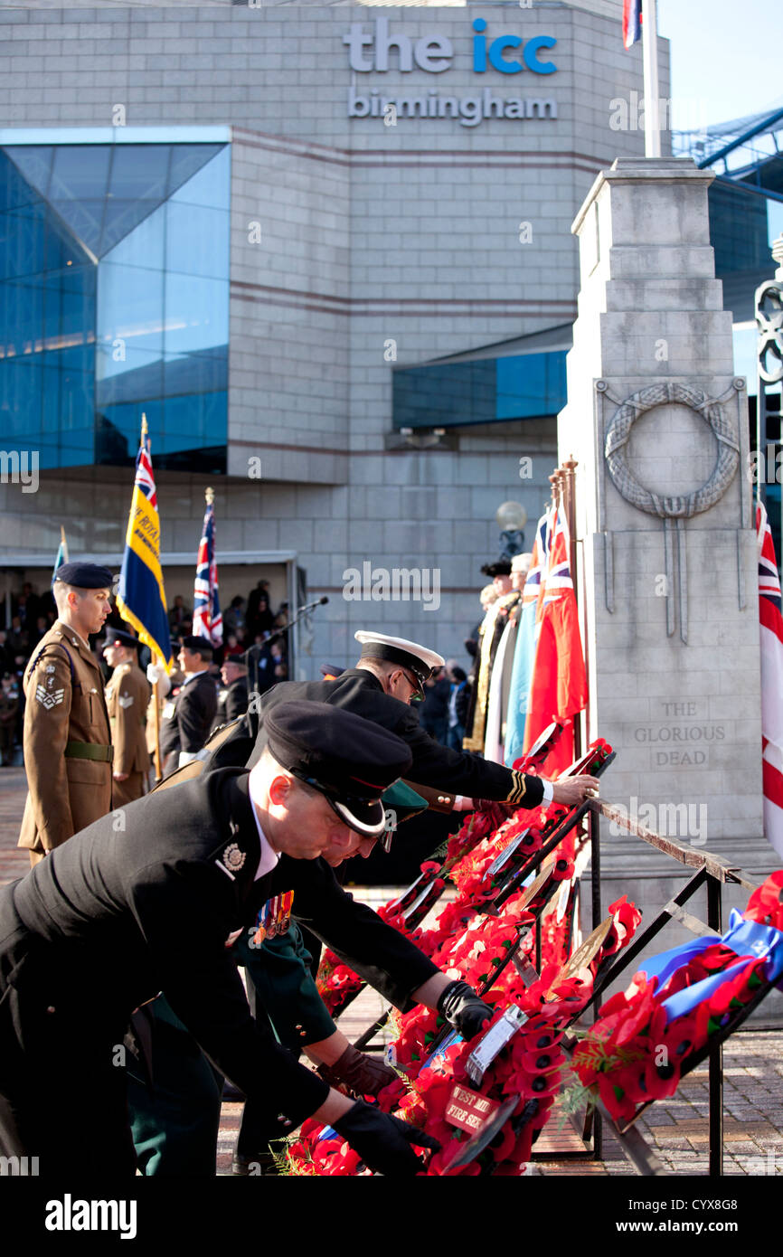 The Remembrance service in Millennium Square, Birmingham, UK. People lay wreaths at a copy cenotaph in front of the ICC. Stock Photo