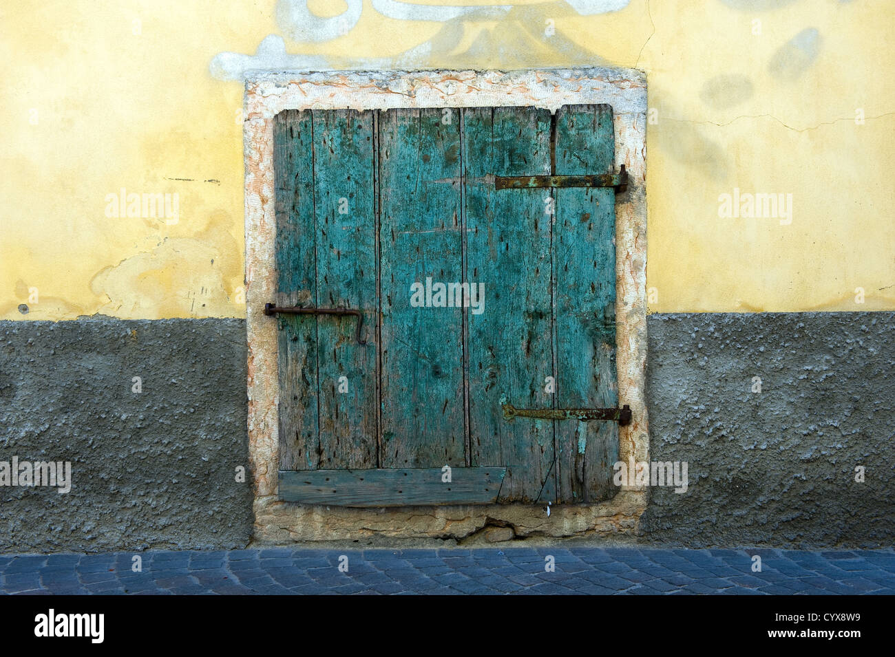 An old green wooden from a house in Toscany in Italy. Stock Photo