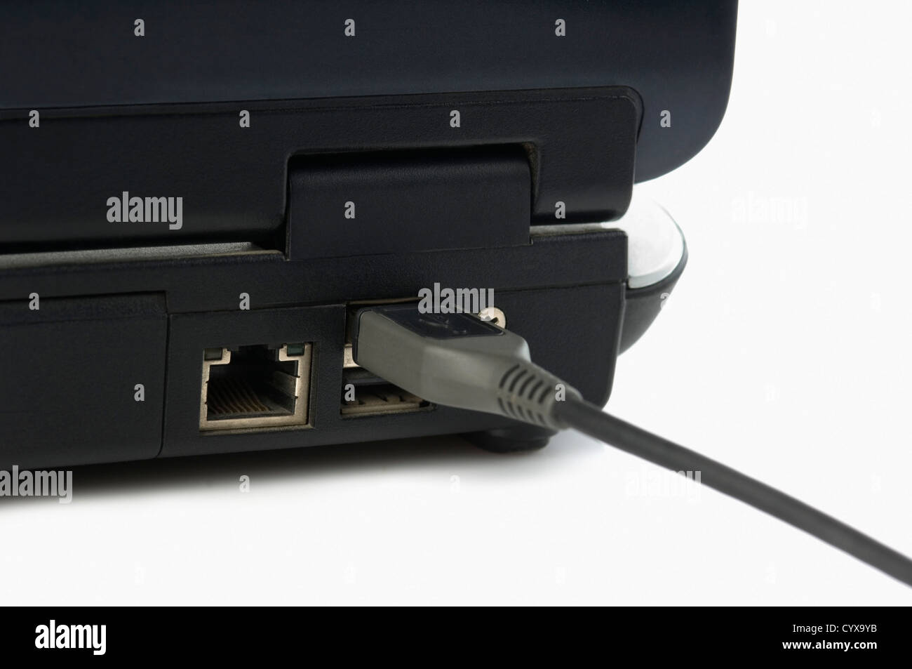 USB cable connected on USB port of a laptop Stock Photo