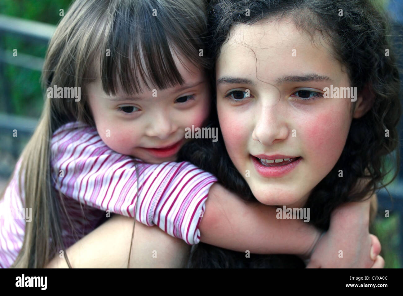 Portrait of beautiful young girls in the park . Stock Photo