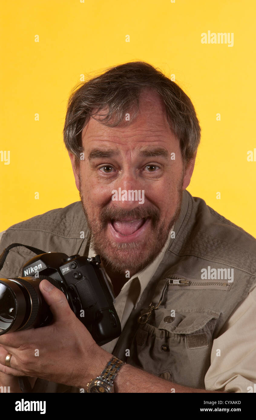 Photographer happy at capturing an image. Stock Photo
