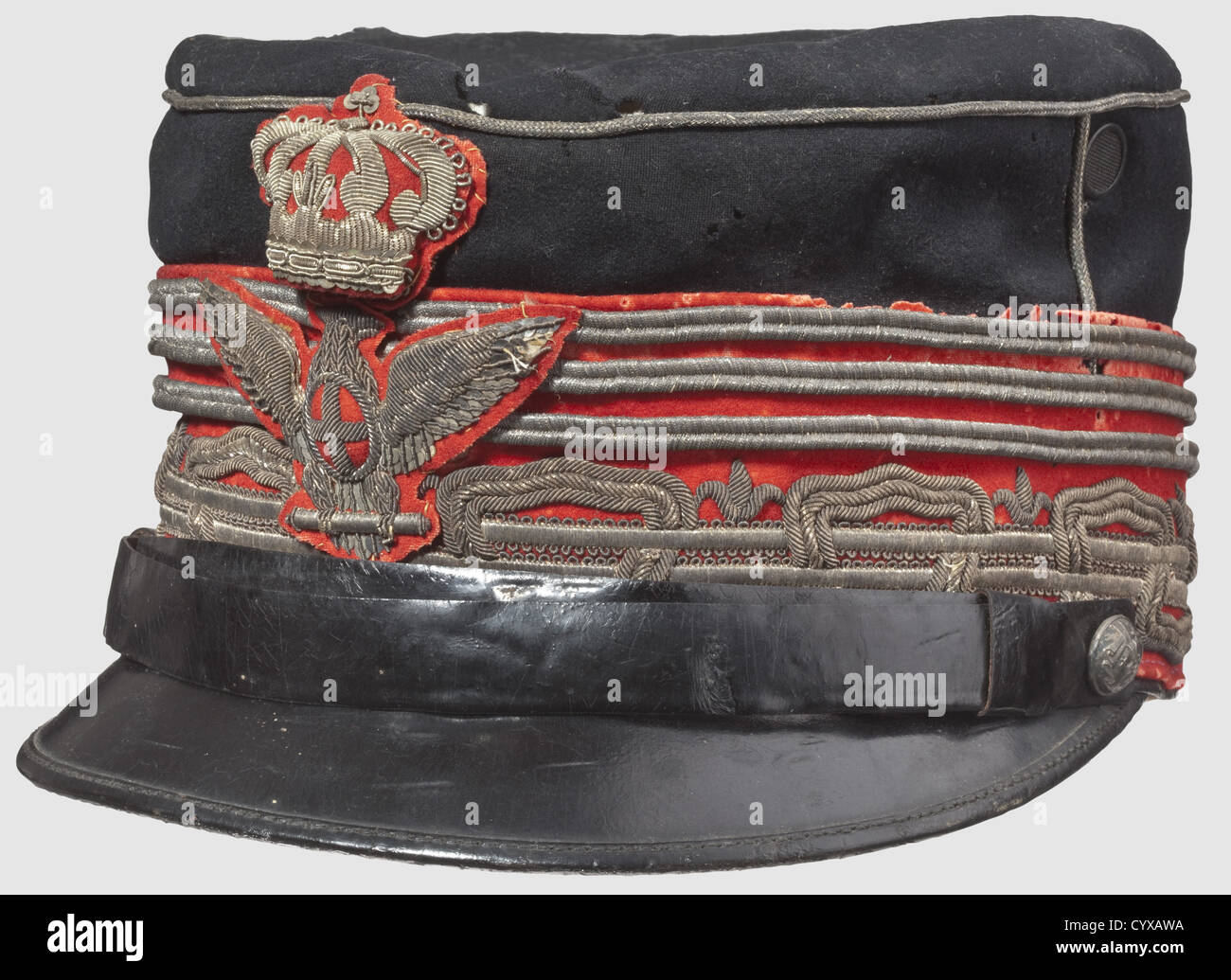 An Italian cap for a General in the Corpo D'Armata, Model 1871 Black cloth and visor, black chin strap, silver braid, the eagle and crown of red cloth. Light silk inner liner with inscription in gold of a maker in Milan/ Florence. Damaged. Very rare, historic, historical, 19th century, uniform, uniforms, clothing, clothes, outfit, outfits, wear, object, objects, stills, clipping, clippings, cut out, cut-out, cut-outs, Additional-Rights-Clearences-Not Available Stock Photo