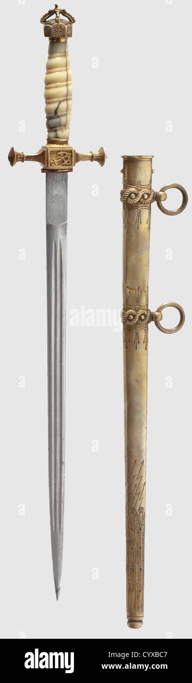 A long dirk M 1890 / 1901 for officers of the Imperial German navy,made by Carl Kaiser,Solingen A Damascus blade in the so-called 'maiden hair' pattern with double fullers and the makerïs logo: crown,swords and 'C.K.and Co.' along with the smith mark 'M 3' on the tang.An open crown pommel with remnants of gilding.Old ivory spiral grip(lightly faded and damaged).Thunder-belt pattern scabbard with remnants of gilding and dents.Total length 48.7 cm.The Carl Kaiser Factory only made these dirks with Damascus blades until 1905.Extremely rare and exclusive,Additional-Rights-Clearences-Not Available Stock Photo