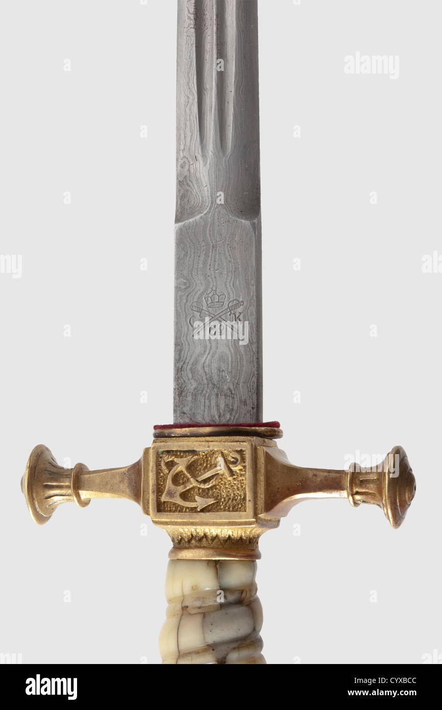 A long dirk M 1890 / 1901 for officers of the Imperial German navy,made by Carl Kaiser,Solingen A Damascus blade in the so-called 'maiden hair' pattern with double fullers and the makerïs logo: crown,swords and 'C.K.and Co.' along with the smith mark 'M 3' on the tang.An open crown pommel with remnants of gilding.Old ivory spiral grip(lightly faded and damaged).Thunder-belt pattern scabbard with remnants of gilding and dents.Total length 48.7 cm.The Carl Kaiser Factory only made these dirks with Damascus blades until 1905.Extremely rare and exclusive,Additional-Rights-Clearences-Not Available Stock Photo