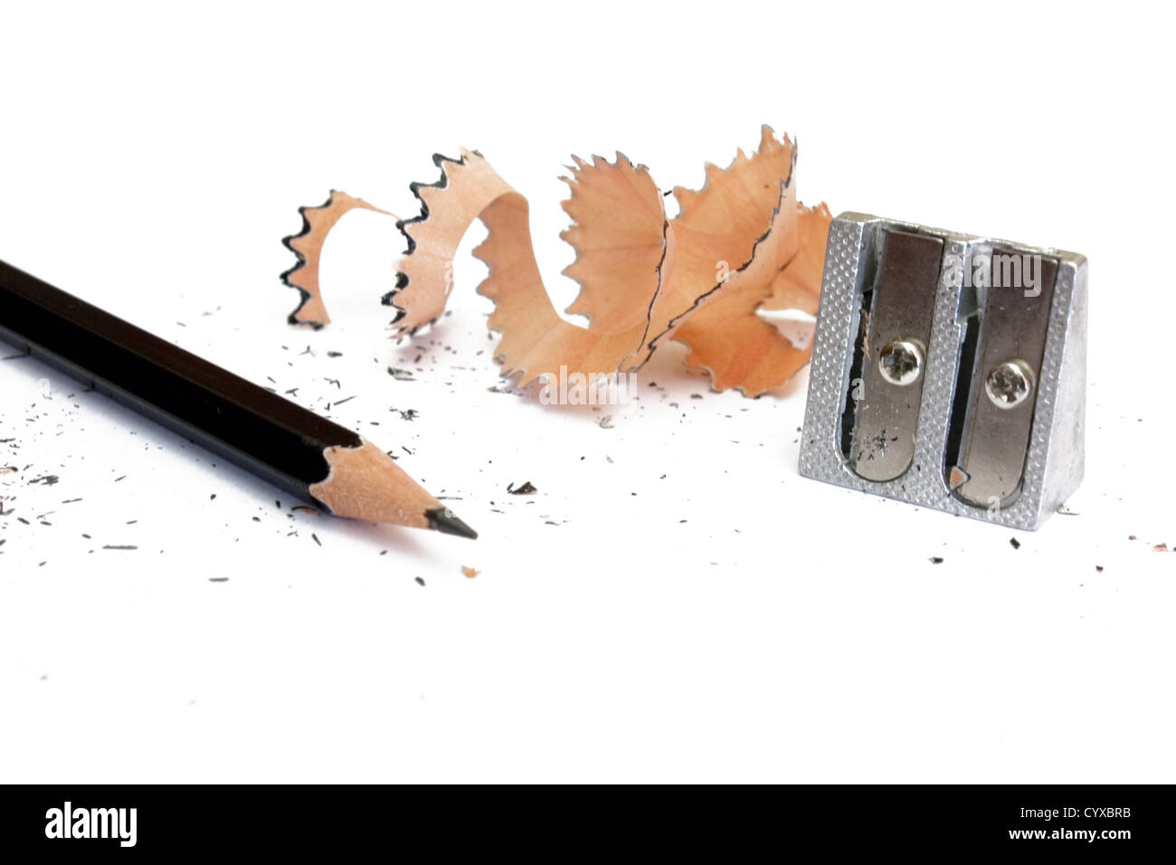 Top view of colored pencils with shavings and pencil sharpener over white  background. top view Stock Photo - Alamy