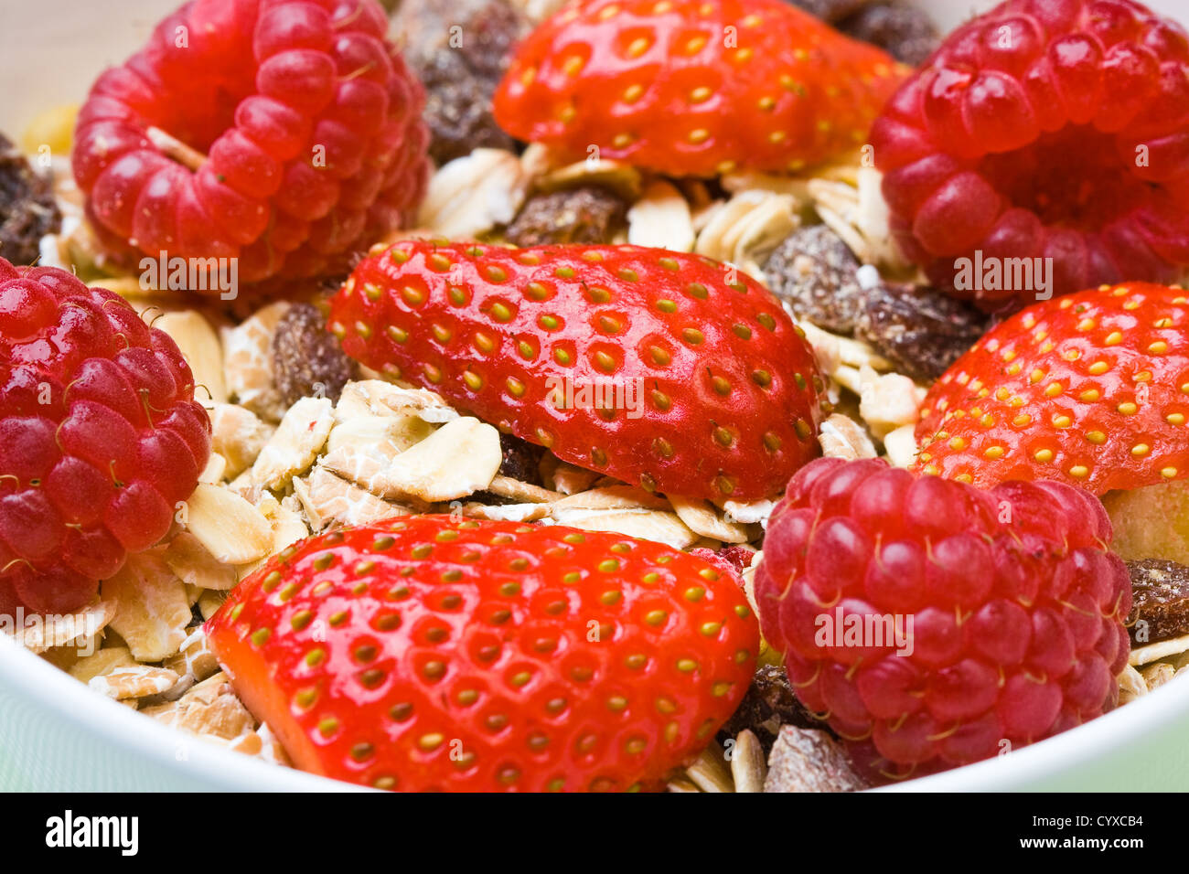 Muesli with fresh raspberries and strawberries Stock Photo