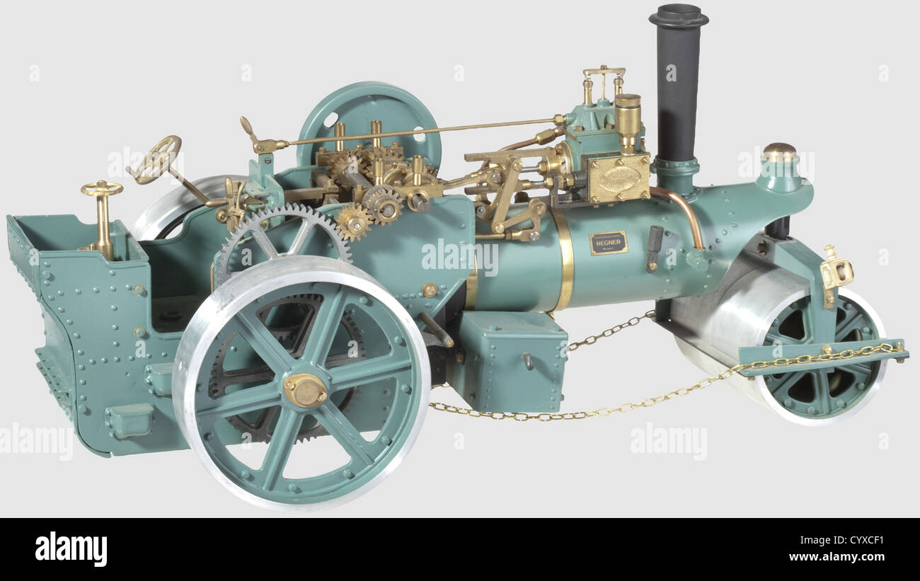A spirit fired model single cylinder road roller, built by Regner, with spoked aluminium rolls, planked canopy mounted on four supports (loose), dummy belly tank, single road speed and many other details, finished in green. 20 x 40 cm, historic, historical, 20th century, steam engine, steam engines, machine, machines, technology, engineering, object, objects, stills, drive, propulsion, motor, power unit, drives, clipping, cut out, cut-out, cut-outs, Additional-Rights-Clearences-Not Available Stock Photo