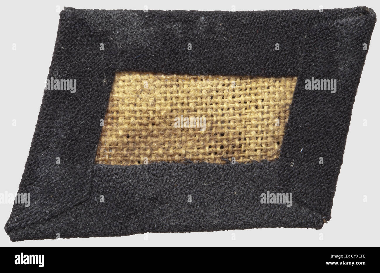 Collar patch for the 'Schalburg-Korps',belonging to the 5th SS-division 'Wiking',of black cotton on a glued linen inlay,RZM-machine- embroidered sunwheel motive. Rare,historic,historical,1930s,20th century,secret service,security service,secret services,security services,police,armed service,armed services,NS,National Socialism,Nazism,Third Reich,German Reich,Germany,utensil,piece of equipment,utensils,object,objects,stills,clipping,clippings,cut out,cut-out,cut-outs,fascism,fascistic,National Socialist,Nazi,Nazi period,unif,Additional-Rights-Clearences-Not Available Stock Photo
