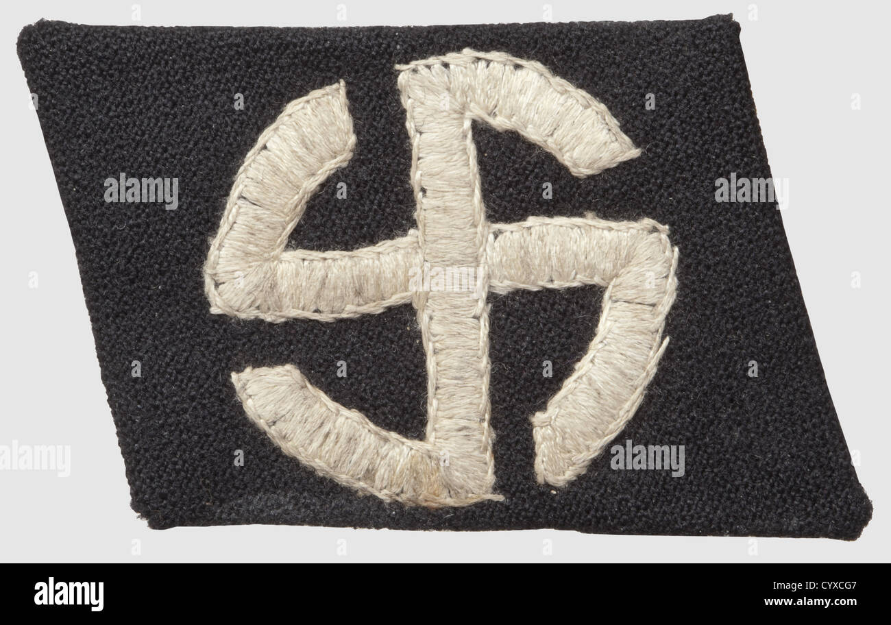 Collar patch for the 'Schalburg-Korps',belonging to the 5th SS-division 'Wiking',of black cotton on a glued linen inlay,RZM-machine- embroidered sunwheel motive. Rare,historic,historical,1930s,20th century,secret service,security service,secret services,security services,police,armed service,armed services,NS,National Socialism,Nazism,Third Reich,German Reich,Germany,utensil,piece of equipment,utensils,object,objects,stills,clipping,clippings,cut out,cut-out,cut-outs,fascism,fascistic,National Socialist,Nazi,Nazi period,unif,Additional-Rights-Clearences-Not Available Stock Photo