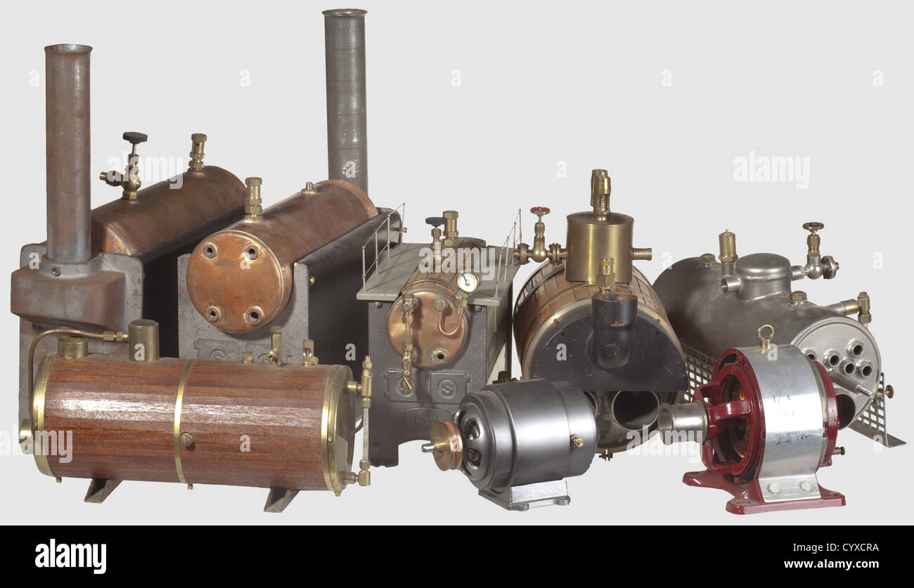 A collection of model steam boilers of various types,including an unpainted welded steel firetube boiler,18 x 38.5 cm,a brass bound,wood lagged return tube boiler,25 x 30 cm,a brass bound wood lagged drum boiler,14.5 x 29.5 cm,a Stuart Babcock type,the copper drum brass bound and wood lagged,21,5 x 28 cm,two partially complete model Stuart Babcock type copper boilers,burners missing ,unpainted,36 x 32.5 cm,all with some fittings. With it a 12 Volt round frame dynamo with belt pulley and cast mounting block,finished in maroon and brightwork,14.5 ,Additional-Rights-Clearences-Not Available Stock Photo