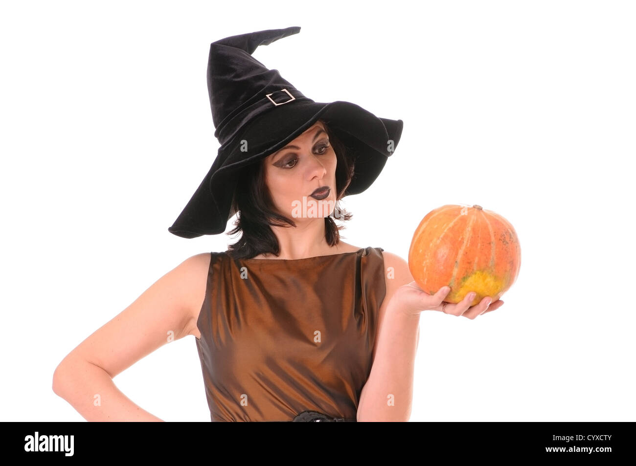 Young witch with pumpkin  isolated on white background Stock Photo