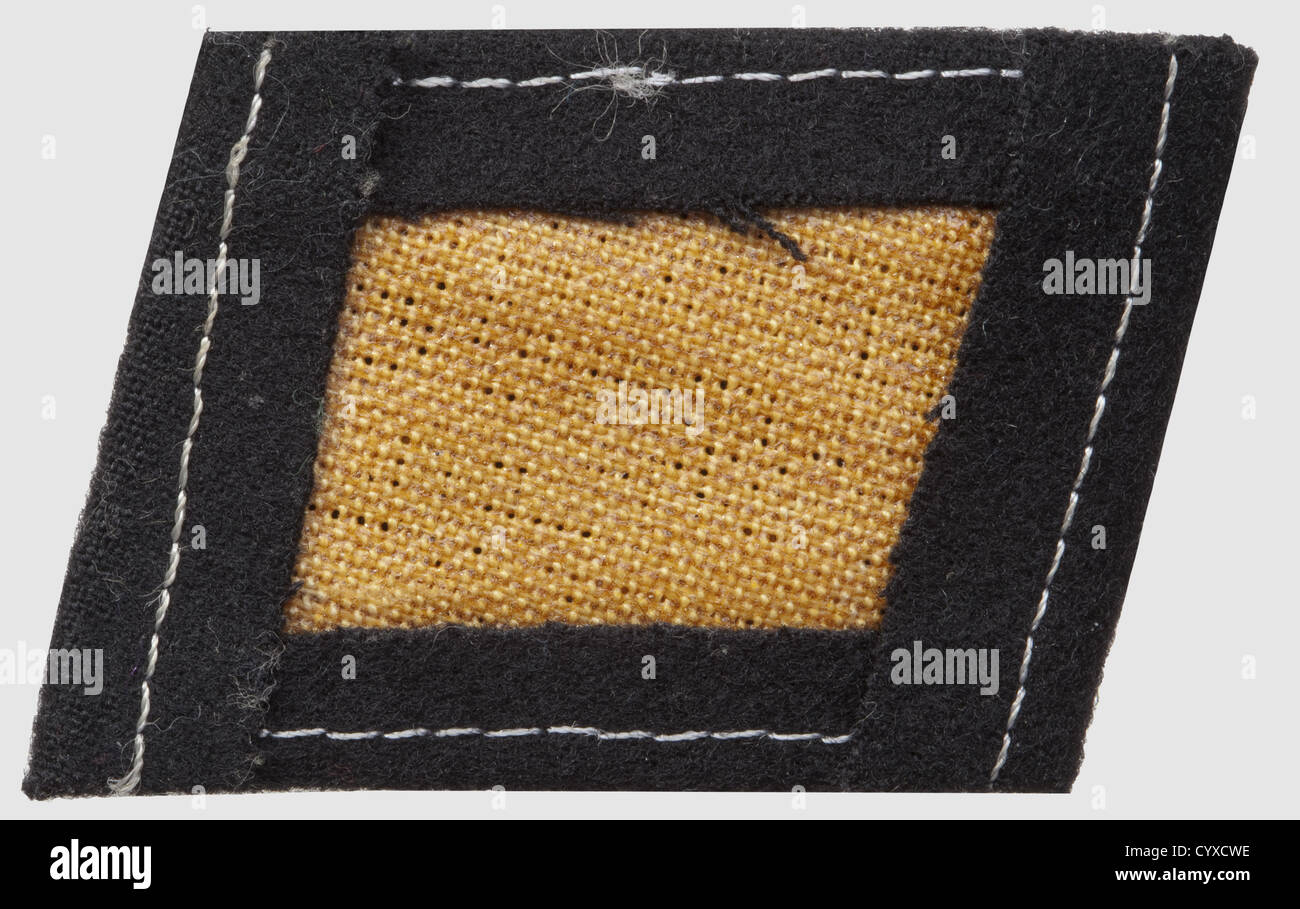 Collar patch for the 36th SS-division 'Dirlewanger',of black wool on a glued linen inlay,RZM-machine-embroidered motif of two crossed guns and a hand grenade. Rare,historic,historical,1930s,20th century,secret service,security service,secret services,security services,police,armed service,armed services,NS,National Socialism,Nazism,Third Reich,German Reich,Germany,utensil,piece of equipment,utensils,object,objects,stills,clipping,clippings,cut out,cut-out,cut-outs,fascism,fascistic,National Socialist,Nazi,Nazi period,uniform,,Additional-Rights-Clearences-Not Available Stock Photo