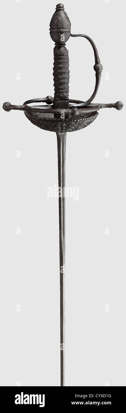 A German small sword,mid 17th century Slender thrusting blade,inscribed 'Pedro del Monte en Toledo' within the short fuller on each side. Finely cut iron hilt,the cup cut and embossed with a design of flowers,one bar broken at the base. Original grip with elaborate iron wire binding and Turk's heads. The pommel en suite and with old repair. Length 117 cm,historic,historical,,17th century,weapons,arms,weapon,arm,baronial,military,militaria,rapier,rapiers,sword,swords,melee weapon,melee weapons,thrusting,thrustings,baton,object,objects,s,Additional-Rights-Clearences-Not Available Stock Photo