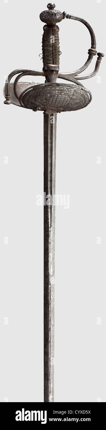 A Spanish colonial cup-hilt rapier,circa 1700 Slender thrusting blade with short fullers,the obverse side inscribed 'IN SOLINGEN'. Hilt with asymmetrical guard decorated with a design of beasts and flowers,original grip with slightly loosened brass wire binding. Cut pommel with rivet at top. Length 117 cm,historic,historical,18th century,weapons,arms,weapon,arm,baronial,military,militaria,rapier,rapiers,sword,swords,melee weapon,melee weapons,thrusting,thrustings,baton,object,objects,stills,clipping,cut out,cut-out,cut-outs,Additional-Rights-Clearences-Not Available Stock Photo