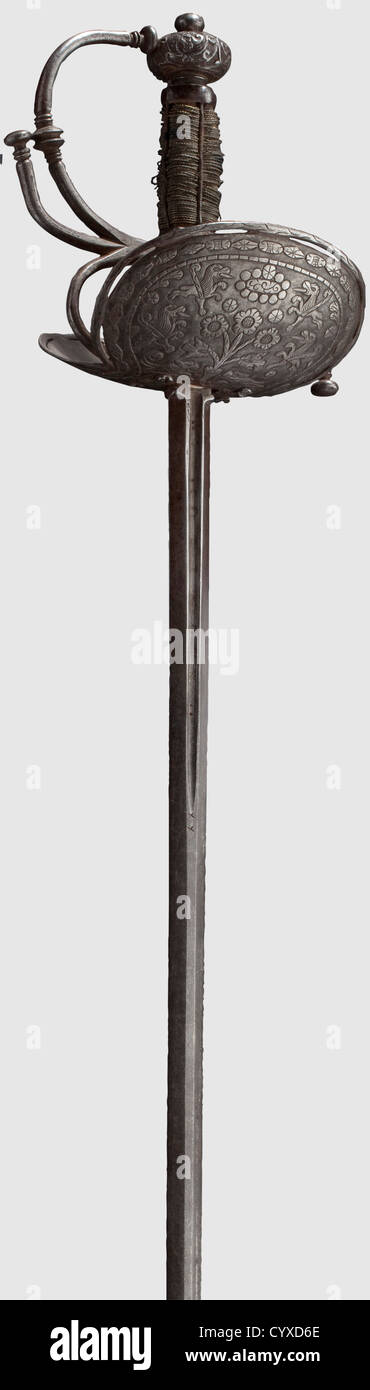 A Spanish colonial cup-hilt rapier,circa 1700 Slender thrusting blade with short fullers,the obverse side inscribed 'IN SOLINGEN'. Hilt with asymmetrical guard decorated with a design of beasts and flowers,original grip with slightly loosened brass wire binding. Cut pommel with rivet at top. Length 117 cm,historic,historical,18th century,weapons,arms,weapon,arm,baronial,military,militaria,rapier,rapiers,sword,swords,melee weapon,melee weapons,thrusting,thrustings,baton,object,objects,stills,clipping,cut out,cut-out,cut-outs,Additional-Rights-Clearences-Not Available Stock Photo