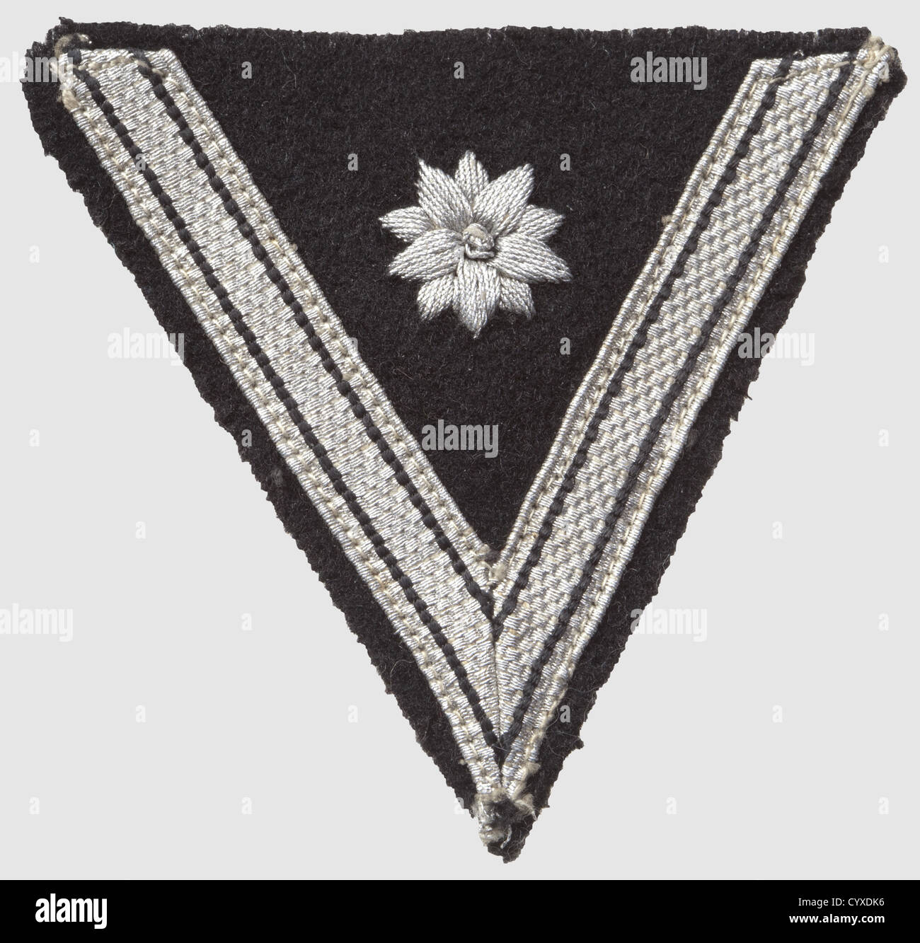 Chevron for 'Old Campaigners', for a member who previously served in Wehrmacht or police. Silver lace and hand-embroidered star on black cloth, on the back RZM-label 'RZM 175/36 SS', historic, historical, 1930s, 1930s, 20th century, SS, Schutzstaffel, NS, National Socialism, Nazism, Third Reich, German Reich, branch of service, branches of service, organisation, organization, organizations, organisations, object, objects, clipping, cut out, cut-out, cut-outs, insignia, symbol, symbols, equipment, uniform, uniforms, detail, details, Additional-Rights-Clearences-Not Available Stock Photo