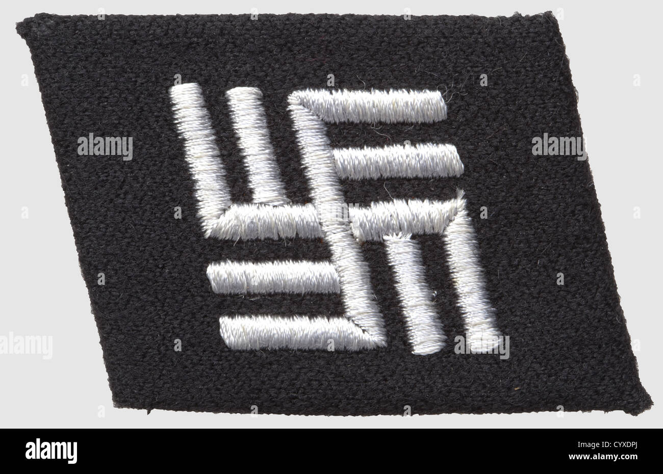 Collar patch for concentration camp guard personnel, of black wool with RZM-machine-embroidered double-svastika motif, historic, historical, 1930s, 1930s, 20th century, SS, Schutzstaffel, NS, National Socialism, Nazism, Third Reich, German Reich, branch of service, branches of service, organisation, organization, organizations, organisations, object, objects, clipping, cut out, cut-out, cut-outs, insignia, symbol, symbols, equipment, uniform, uniforms, detail, details, Additional-Rights-Clearences-Not Available Stock Photo