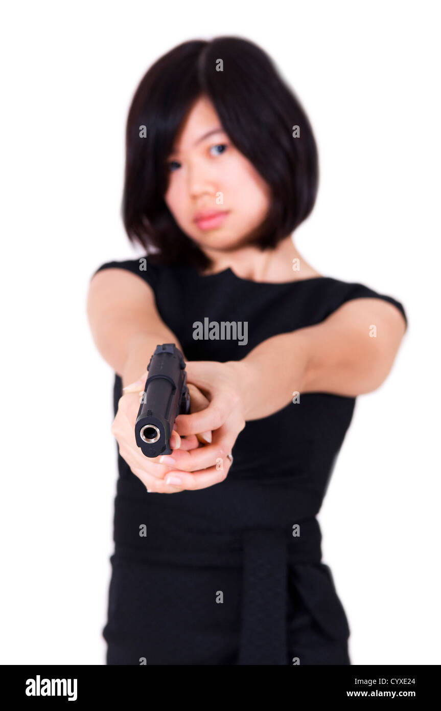 Beautiful Asian bodyguard woman holding a gun Stock Photo Alamy