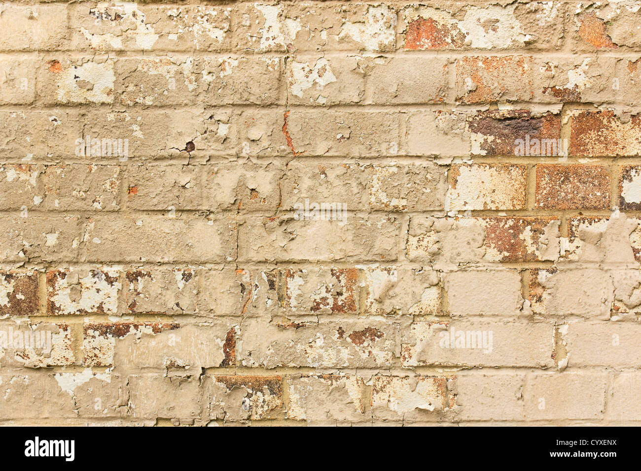 Aged crumbling brick wall background Stock Photo