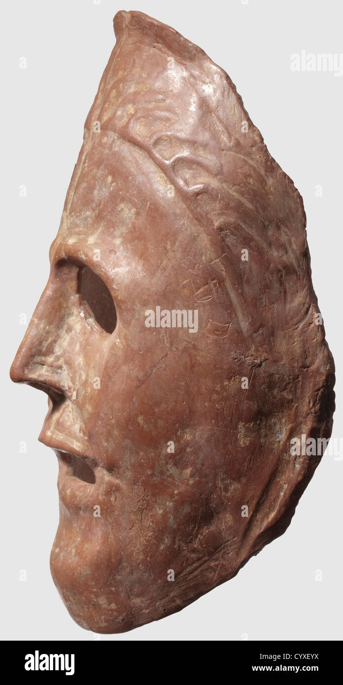 A Greek theatre mask, 6th/5th century B.C. Reddish ceramic. Semicircular, naturalistically modelled mask with openings for the eyes, mouth and nose, stylised hair on the forehead. Remains of lime sintering, small chipping above the forehead on the right. Height 24 cm. Provenance: from an old Bochum collection, historic, historical, ancient world, ancient world, ancient times, object, objects, stills, clipping, cut out, cut-out, cut-outs, mediterranean, precious metal, precious metals, mask, masks, Additional-Rights-Clearences-Not Available Stock Photo