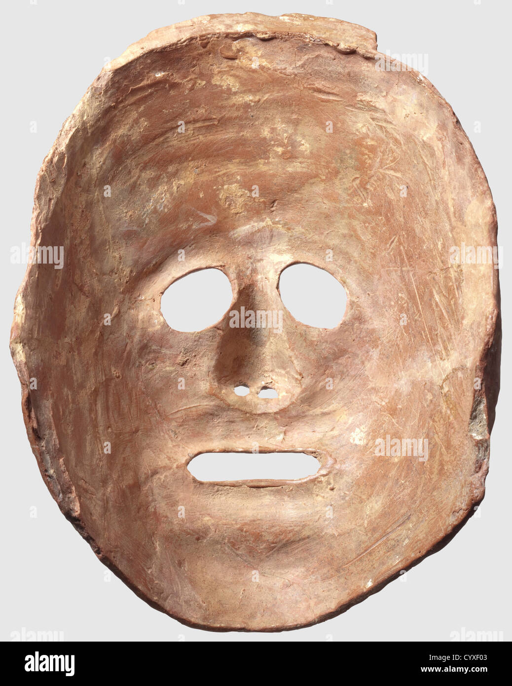 A Greek theatre mask, 6th/5th century B.C. Reddish ceramic. Semicircular,  naturalistically modelled mask with openings for the eyes, mouth and nose,  stylised hair on the forehead. Remains of lime sintering, small chipping