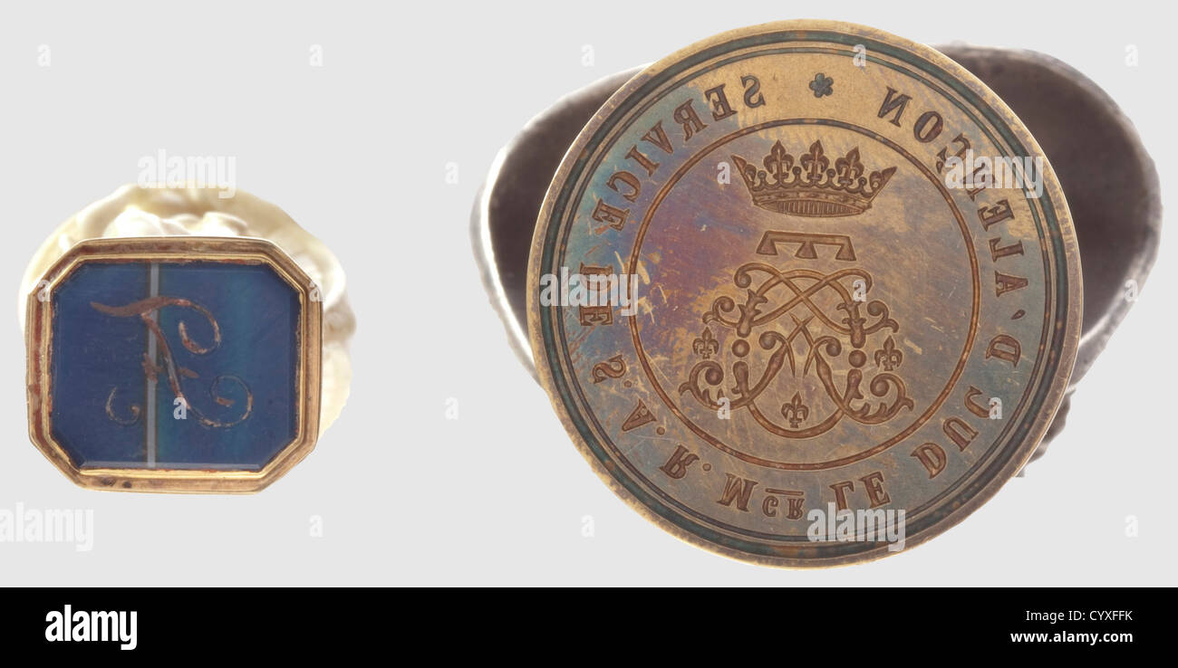 Ferdinand d'Orléans, Duc d'Alencon (1844 - 1910), two seals from the spouse of Duchess Sophie Charlotte in Bavaria The monogram 'F.' cut into a blue agate stone, golden mounting with tendrils in relief, ivory handle with the carved depiction of a rendezvous between a nobleman and a lady in an arbour, height 60 mm. The second seal with the mirror monogram 'F' cut in brass underneath the ducal crown as well as continuous inscription 'Service de S.A.R. Mgr. Le Duc D'Alencon', the handle shaped like the bust of a French nobleman from the 18th century, height 70 mm., Stock Photo