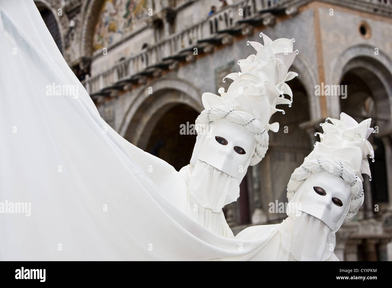 Two people in costume at the Venice Carnival Stock Photo - Alamy